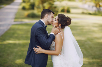 young-beautiful-bride-her-husband-standing-summer-park-with-bouquet